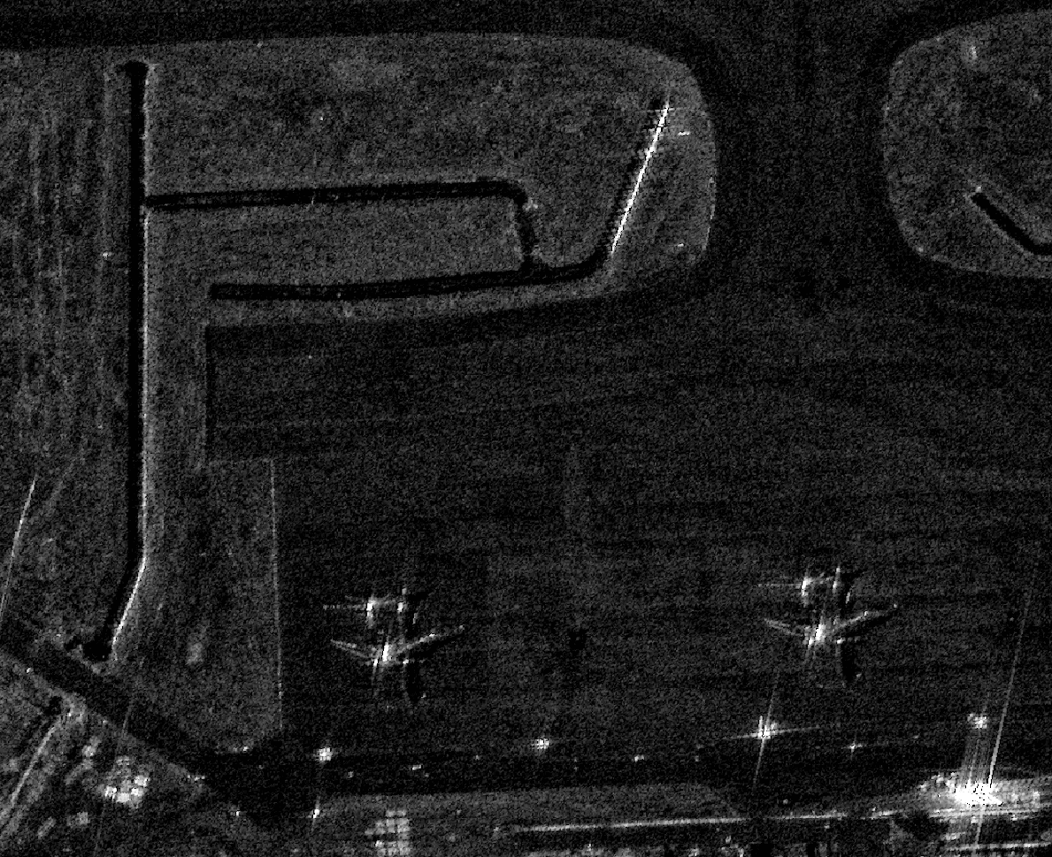 SAR image of Niger Air Base 101 at 4 looks; smoother surfaces and finer structural detail across airfield features.