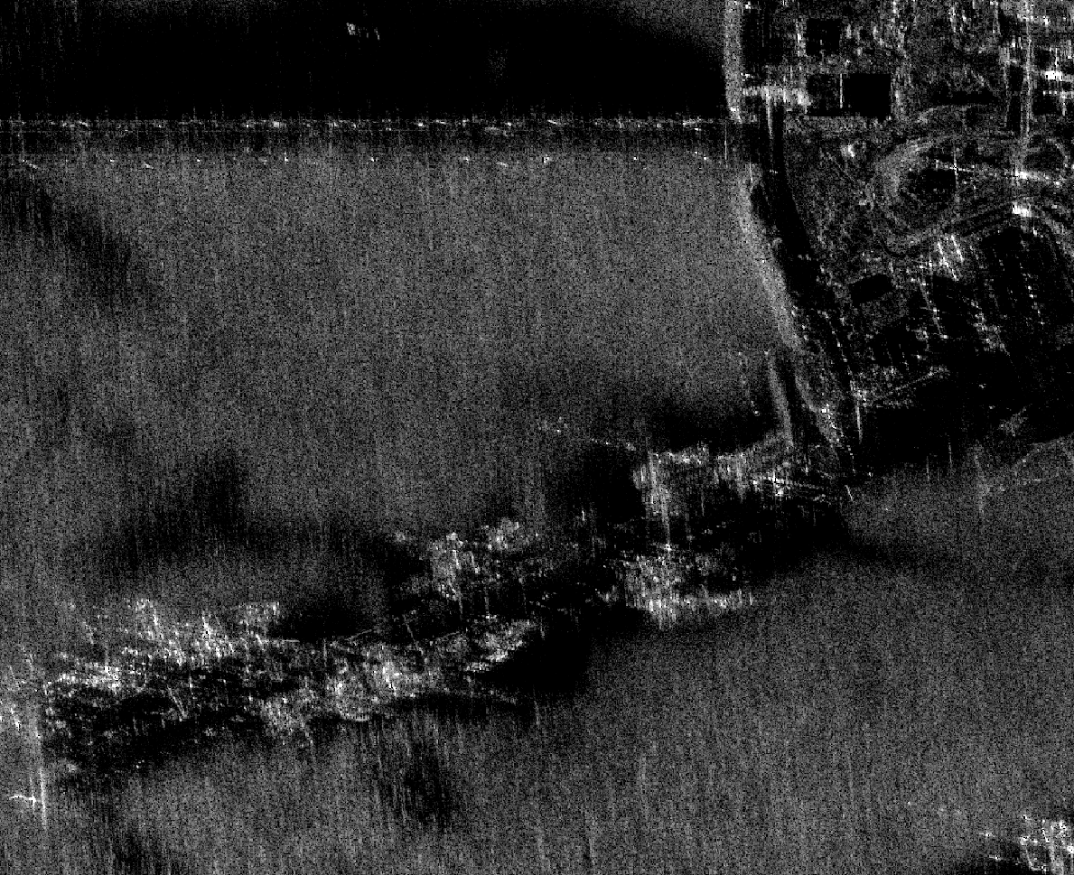 SAR image of Kawar Naval Base at 2 looks; reduced speckle with clearer quays, piers, and vessel outlines.